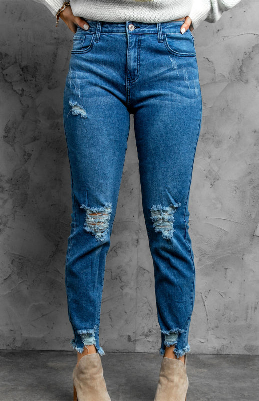 Klassische, verwaschene Slim-Fit-Jeans mit mittlerer Leibhöhe und Rissen