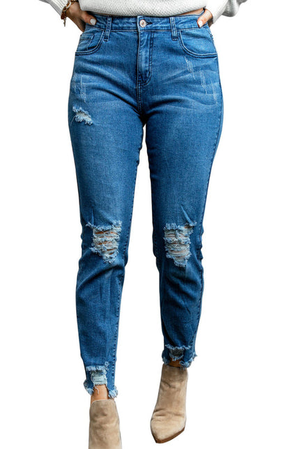 Klassische, verwaschene Slim-Fit-Jeans mit mittlerer Leibhöhe und Rissen