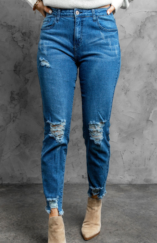 Klassische, verwaschene Slim-Fit-Jeans mit mittlerer Leibhöhe und Rissen